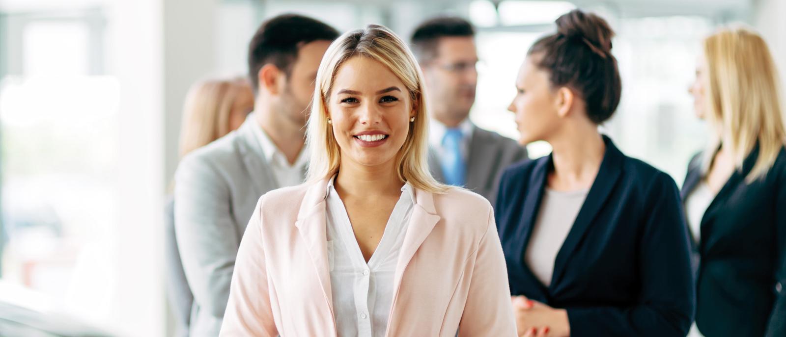 Team of professional salespeople at car dealership