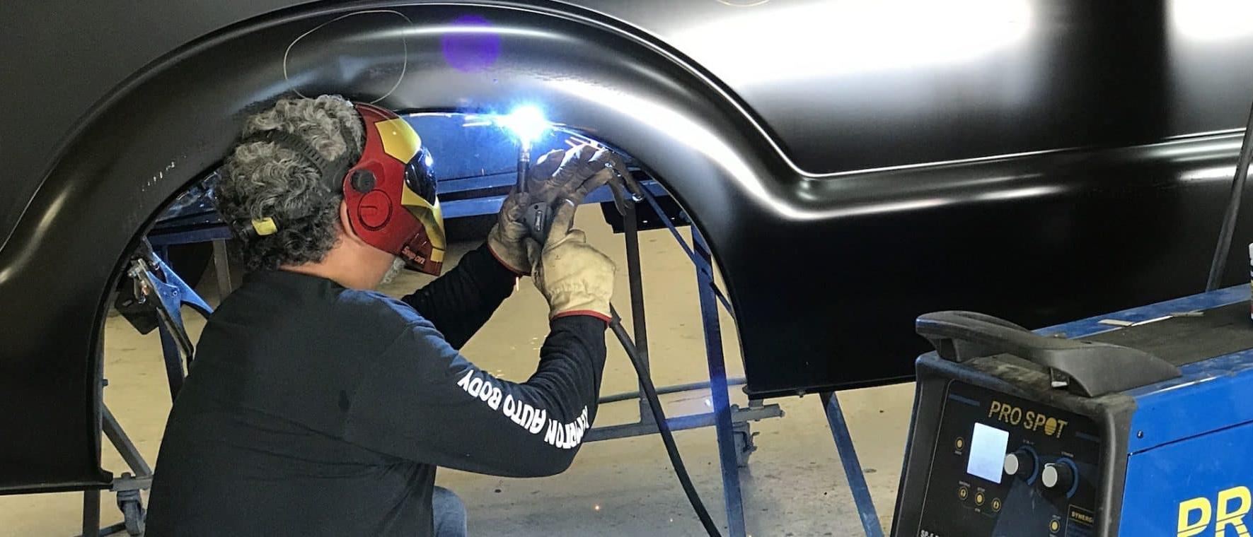 technician working on truck restoration in kempton auto-body