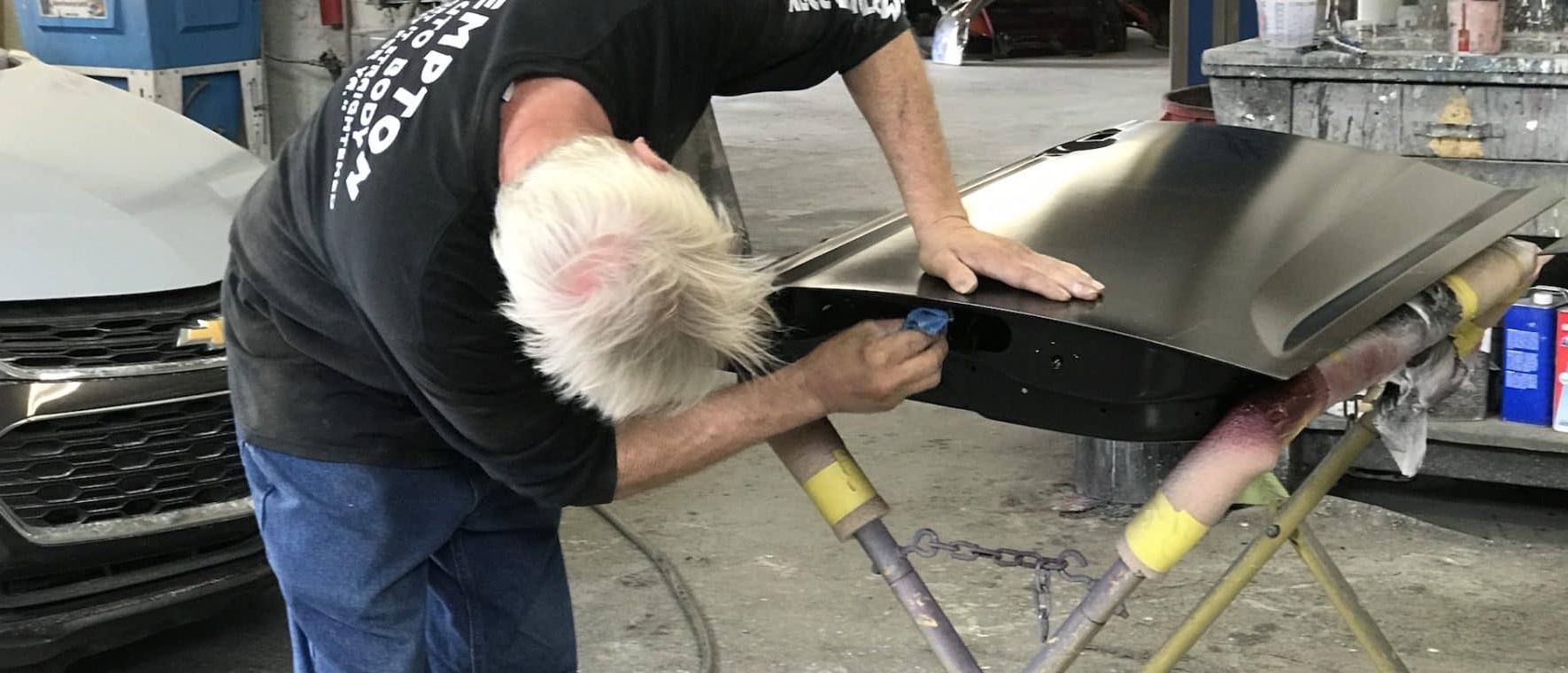 technician working on vehicle part
