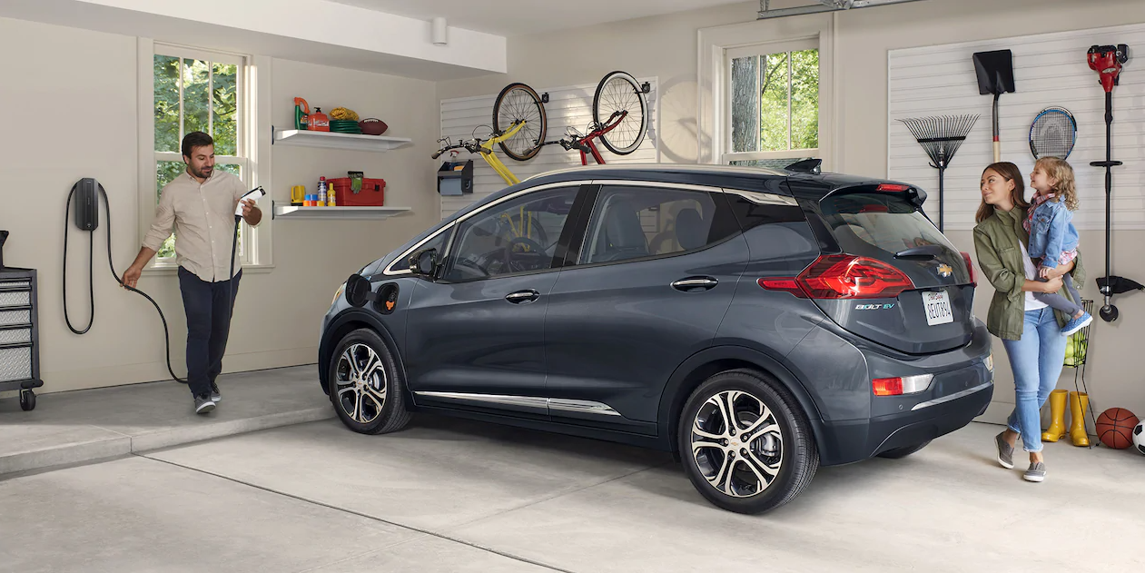 Family with their Chevrolet Bolt EV in the garage