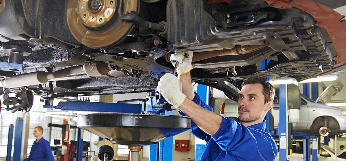 Mechanics working on a vehicle