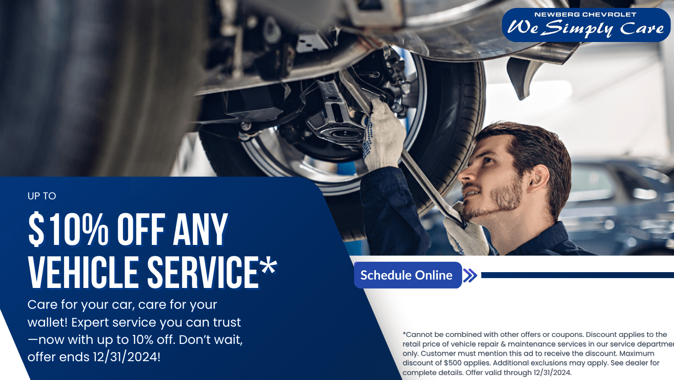 Certified mechanic performing vehicle maintenance, offering up to 10% off auto repair and service. Includes oil changes, brake repair, alignments, and more. Offer ends 12/31/2024.