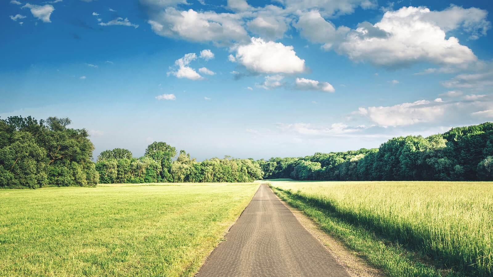 Rural road under a blue sky