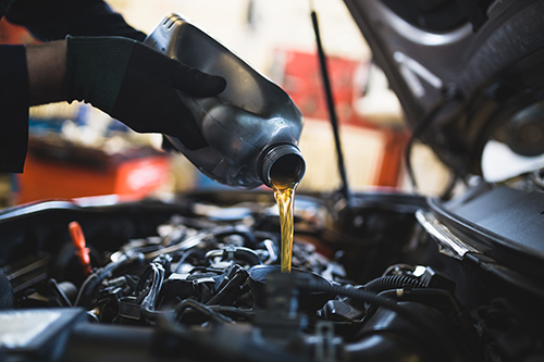 A technician performing a Buick oil change