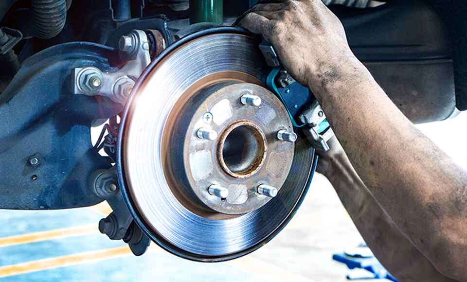 Buick Technician Servicing Brakes