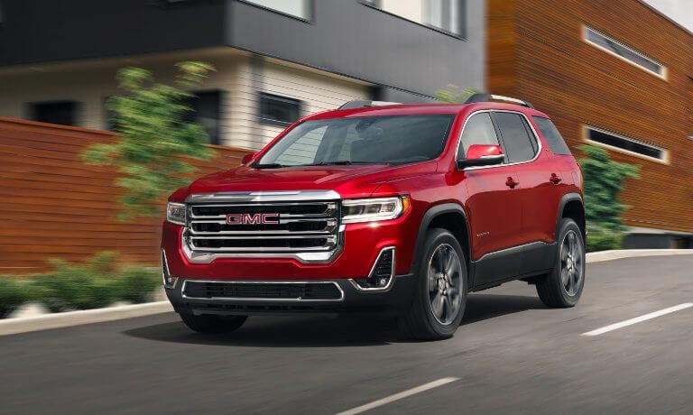 2023 GMC Acadia exterior driving though town