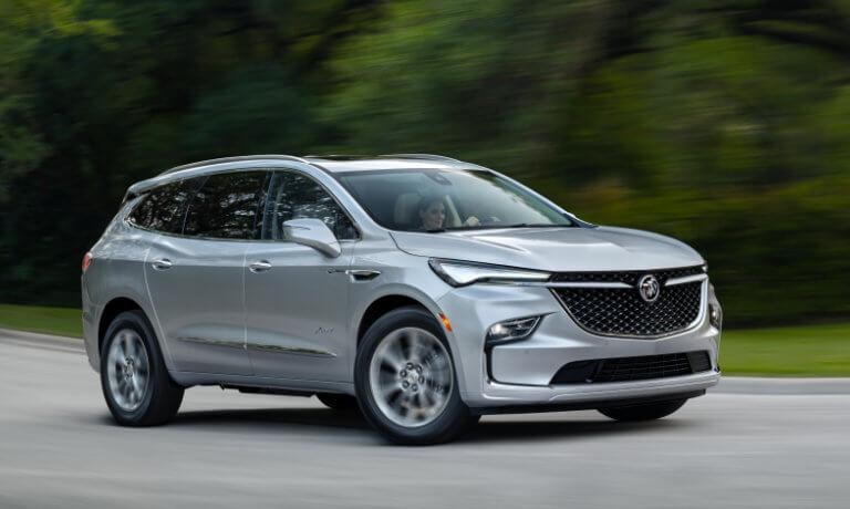 2024 Buick Enclave exterior driving on rural road