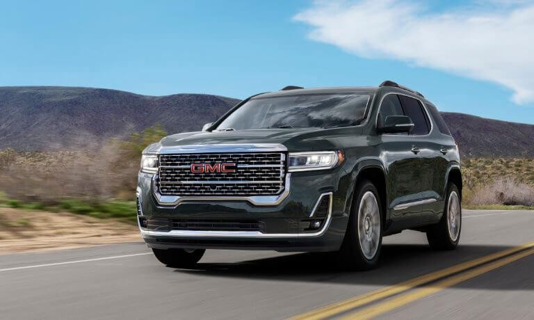 2023 GMC Acadia exterior driving desert highway