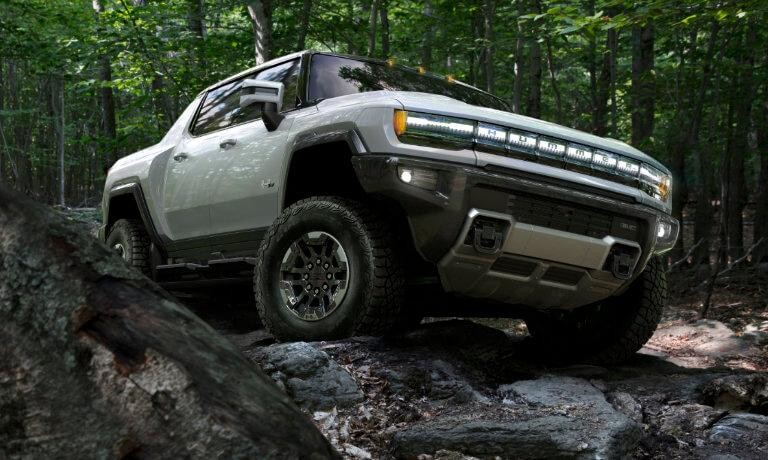 2022 GMC Hummer EV Truck exterior offroad on rocks