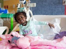 Girl in hospital bed at childrens