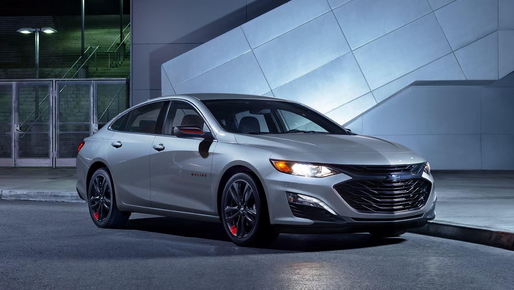 2025 Chevy Malibu parked in front of a cement building