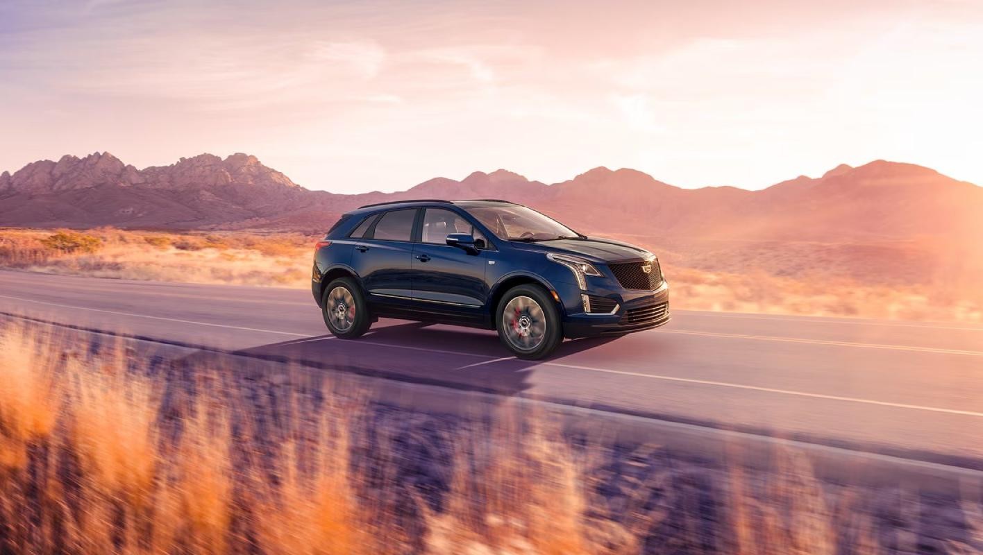 Cadillac XT5 driving on a country road