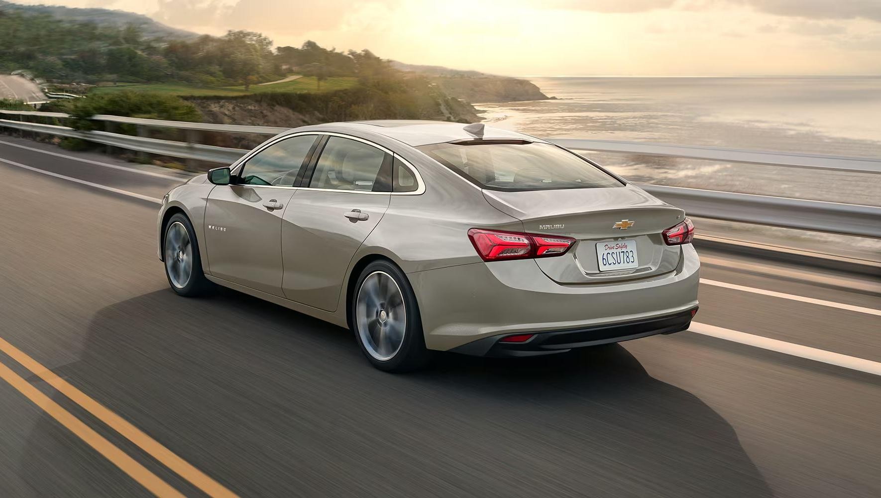 2025 Chevy Malibu driving on a coastal road