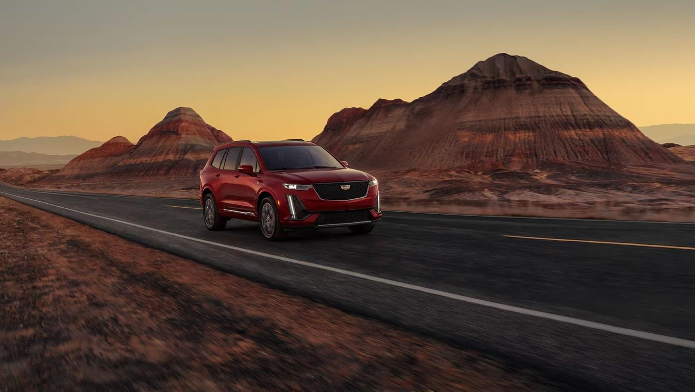 2025 Cadillac XT6 driving on a country road