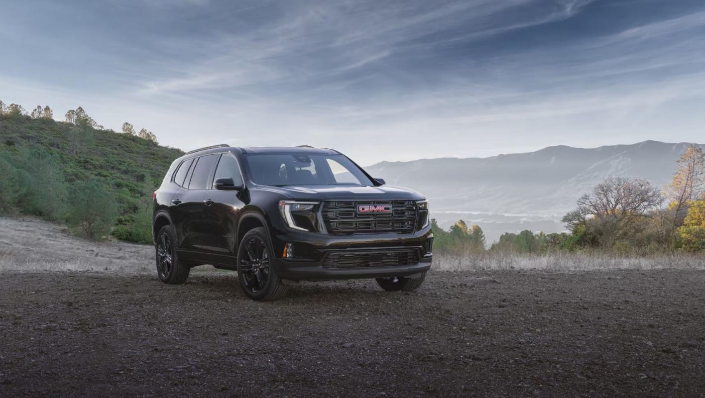 2025 GMC Acadia oarked in a gravel parking lot