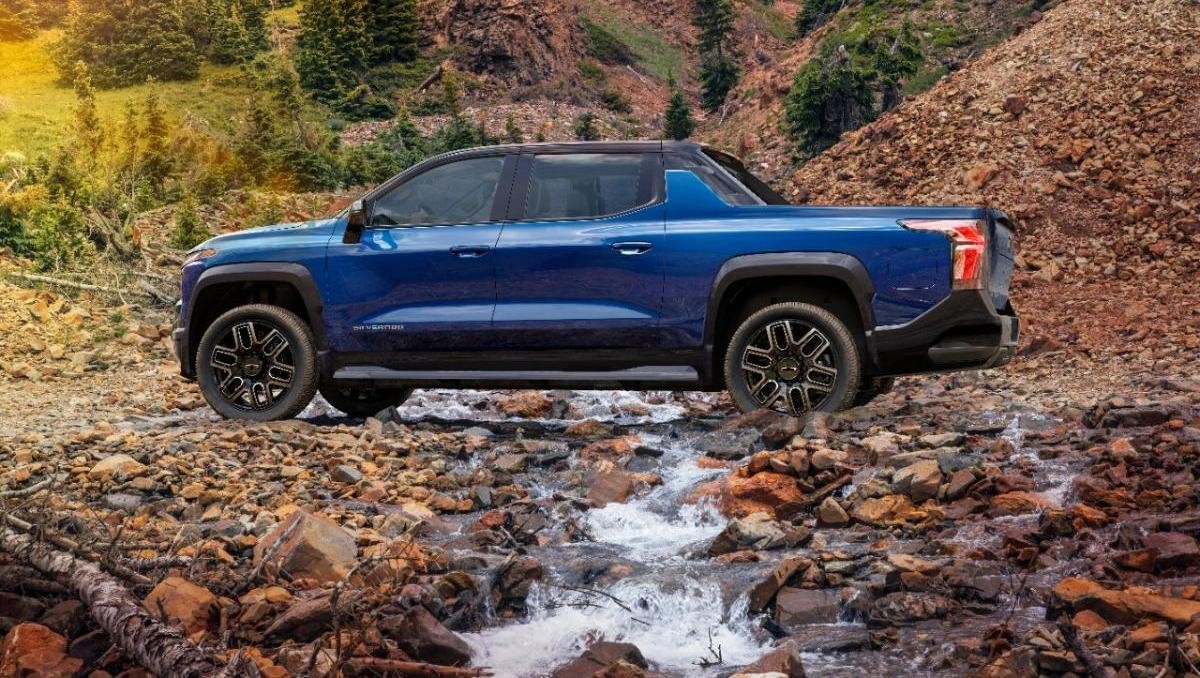 blue 2024 Silverado EV RST parked on a mountain road