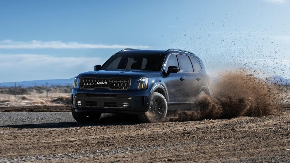 2024 Kia Telluride peeling out on a gravel road