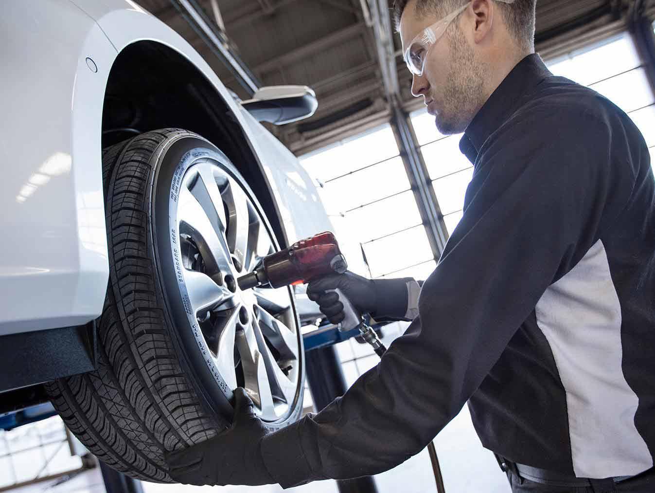Tire changing in service bay Tire changing in service bay