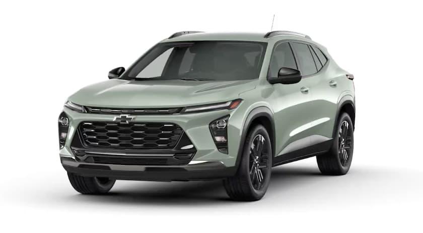 A sage green 2024 Chevy Trax is angled right. A sage green 2024 Chevy Trax is angled right.
