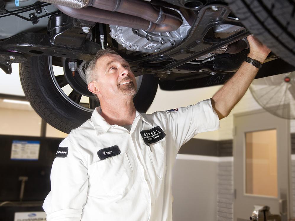 Sewell Mechanic fixing a vehicle