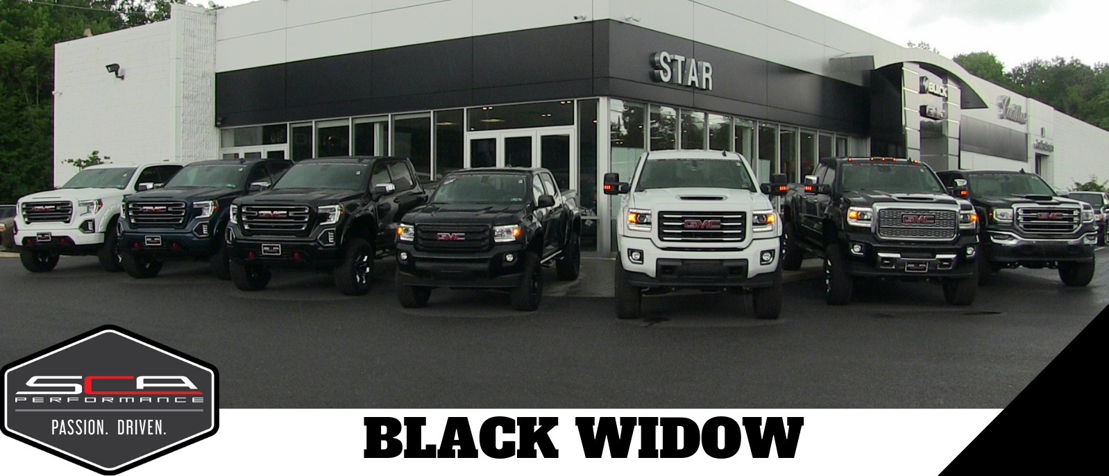 The line up of Black Widow GMC Sierra 1500 trucks at Star Buick GMC