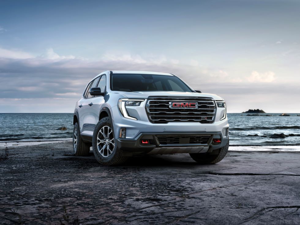 A white 2024 GMC Acadia AT4 SUV.