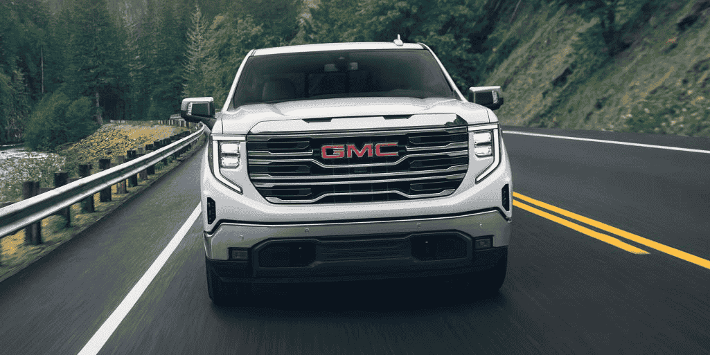 A 2025 GMC Sierra 1500 drives down the road with a host of active safety features.