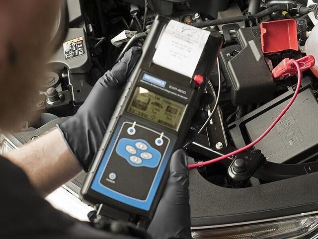 Service technician working on a vehicles