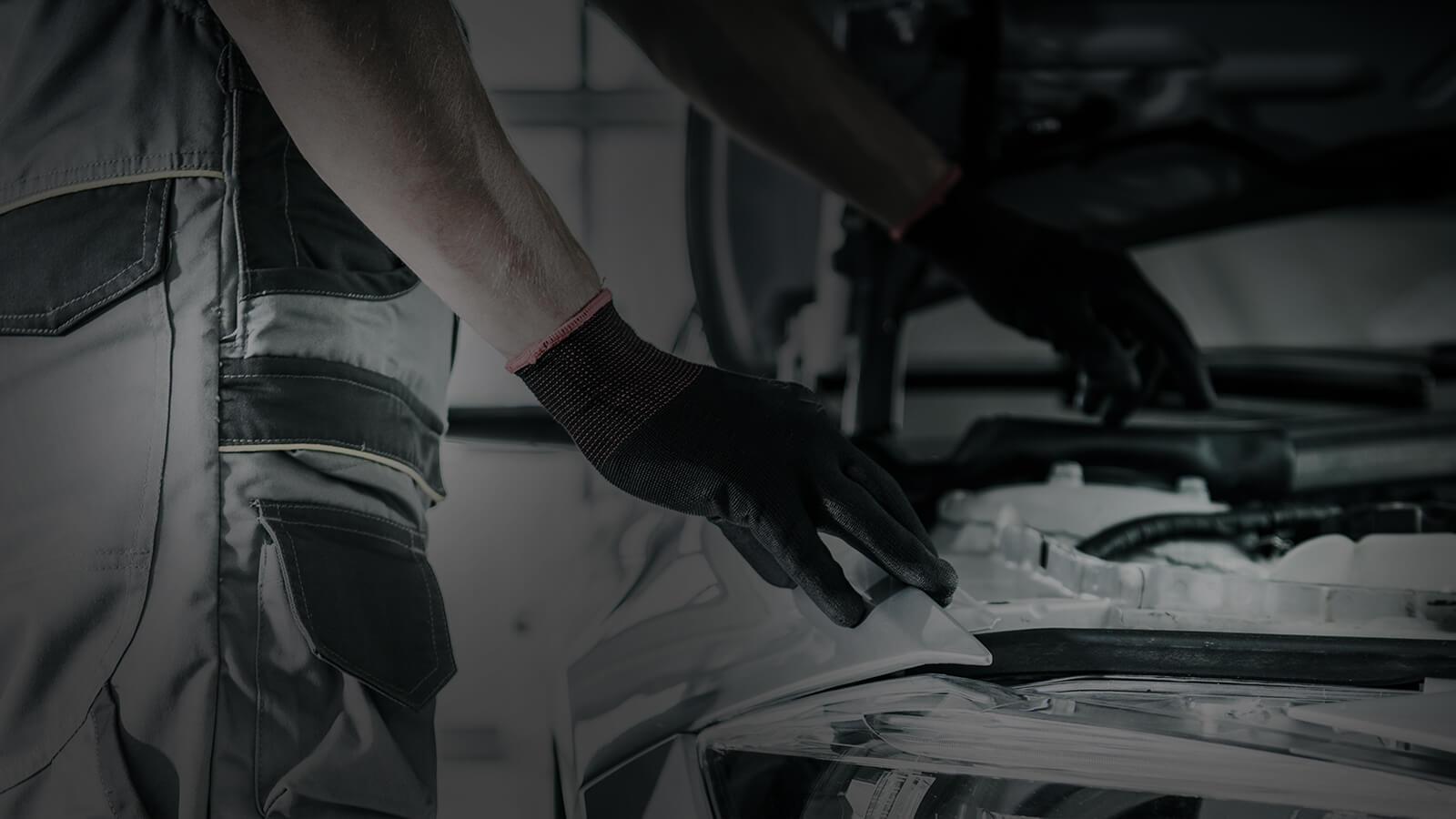 Service mechanic working on an engine
