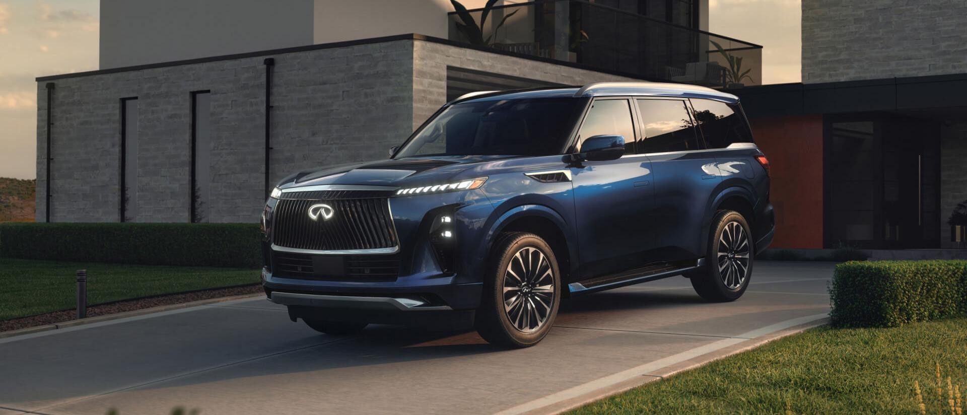 2025 Infiniti QX80 gran blue color parked in driveway