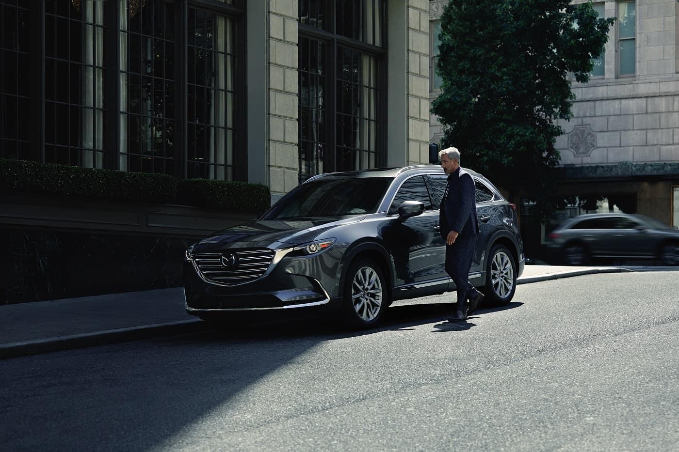 Man standing near 2020 MAzda CX-9.