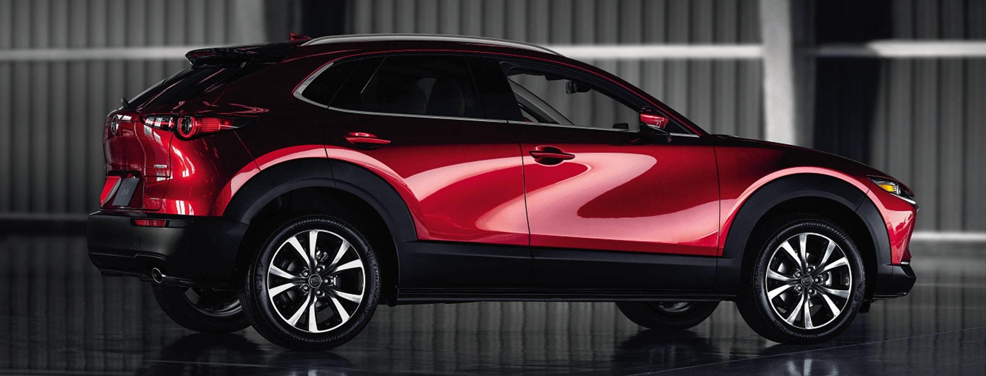 Red Mazda CX-30 side angle.
