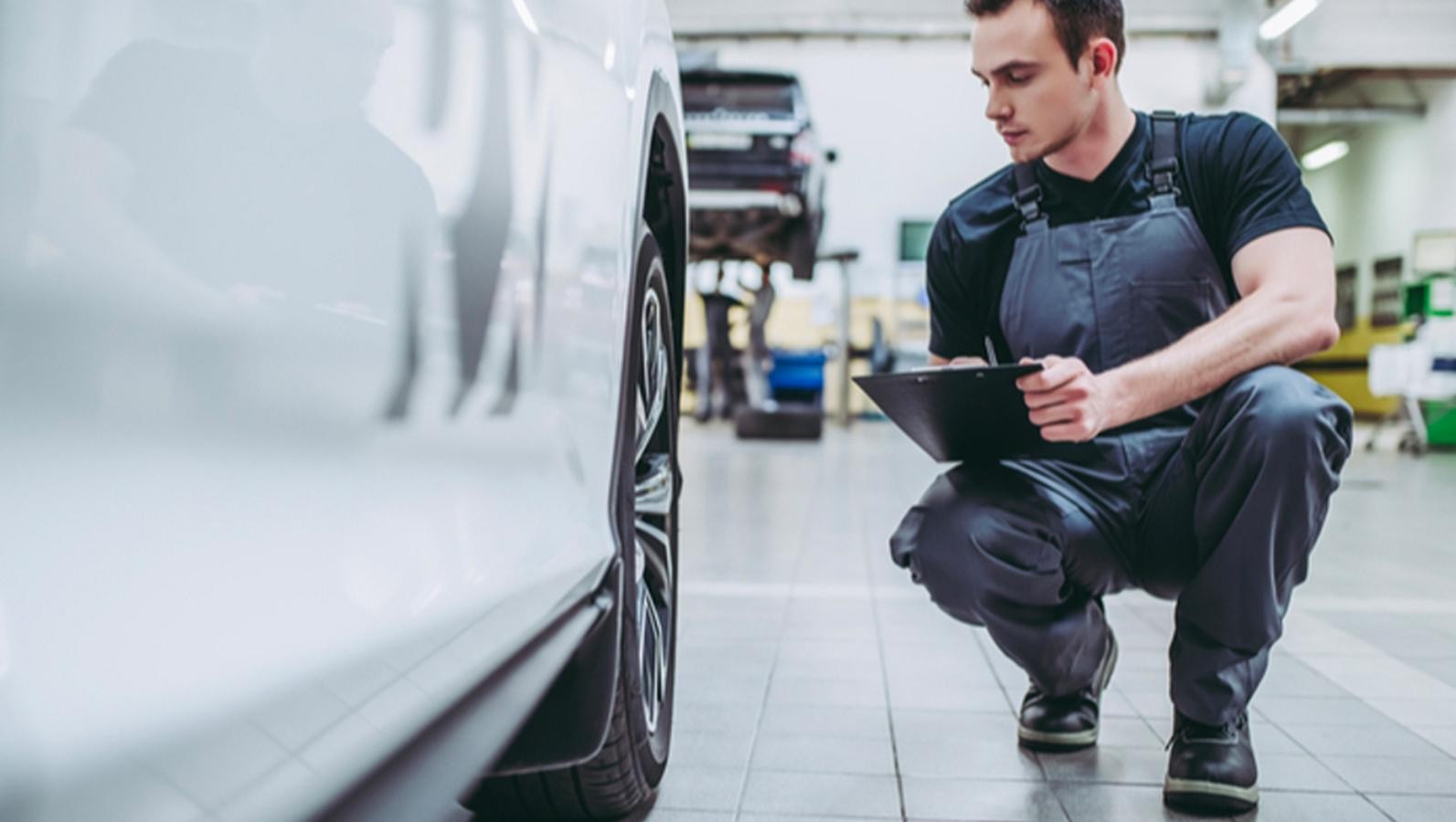 Expert inspecting a car