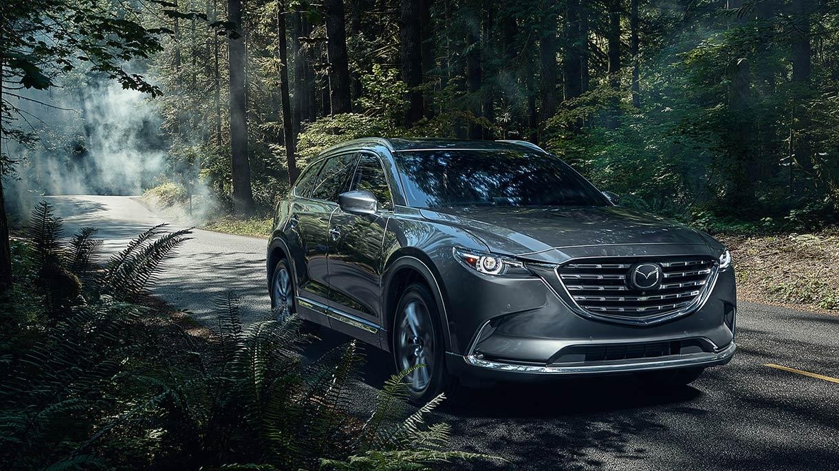 2021 Mazda CX-9 driving in a forest