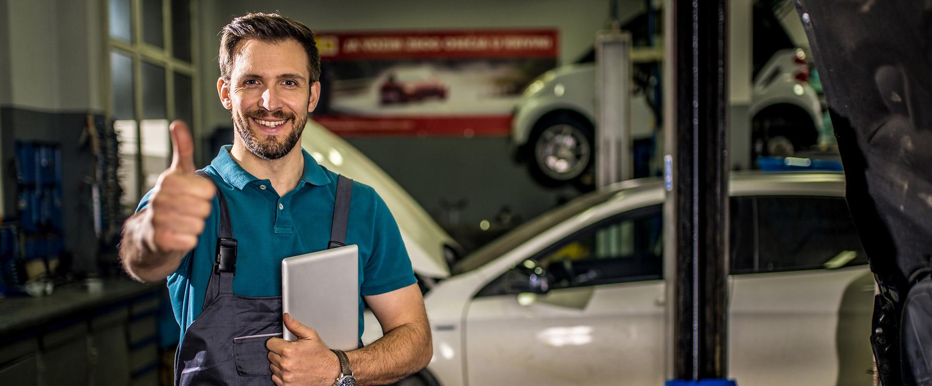 Collision Technician raising thumb