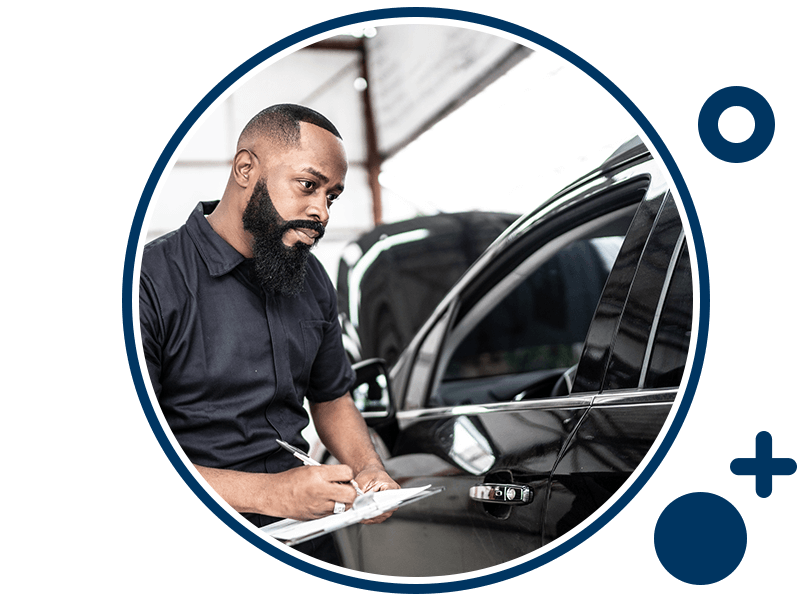 Technician conducting car inspection