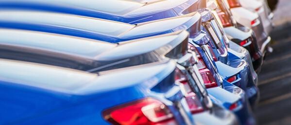 Vehicles parked on a dealership sales lot