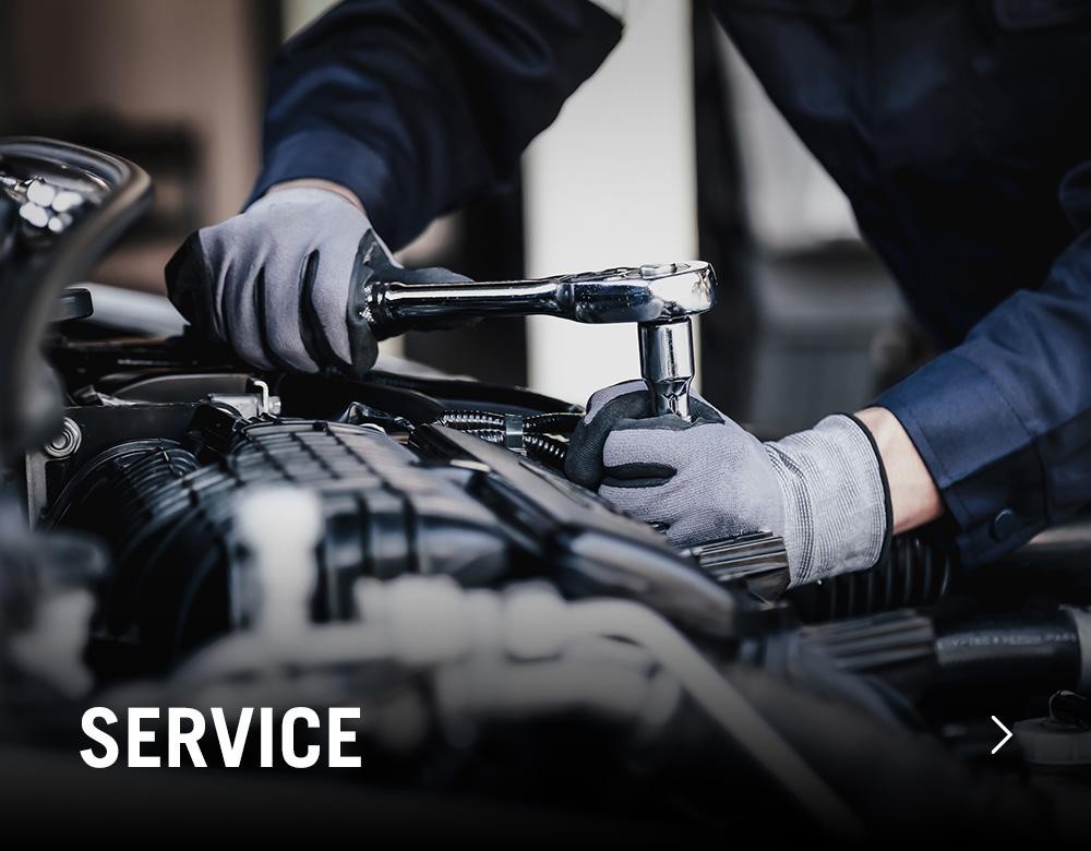 Man working on car engine