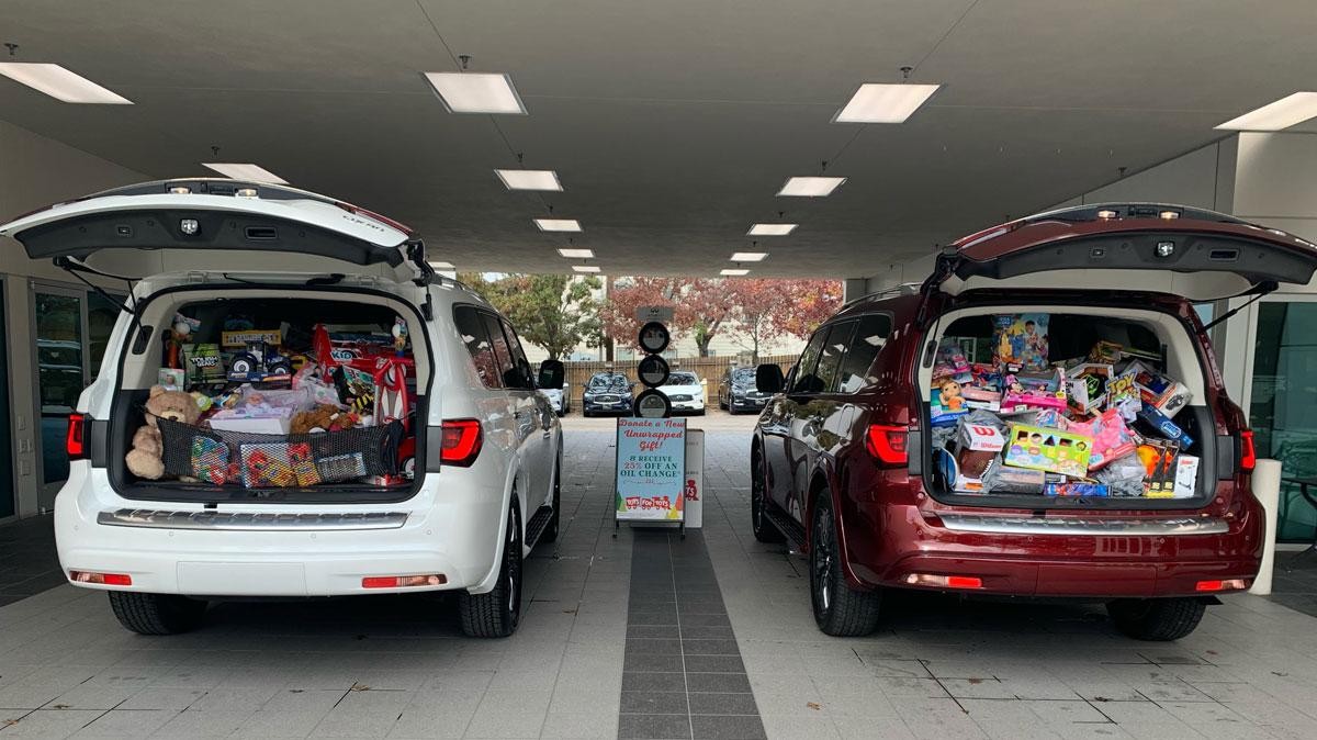 Toys for Tots toys filling the back of INFINITI vehicles.