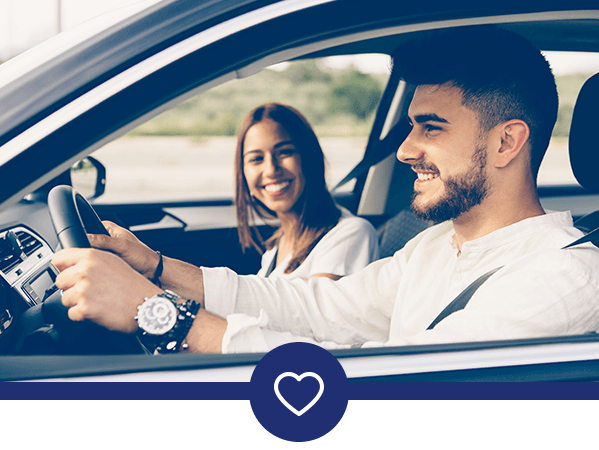 Couple driving in a vehicle.