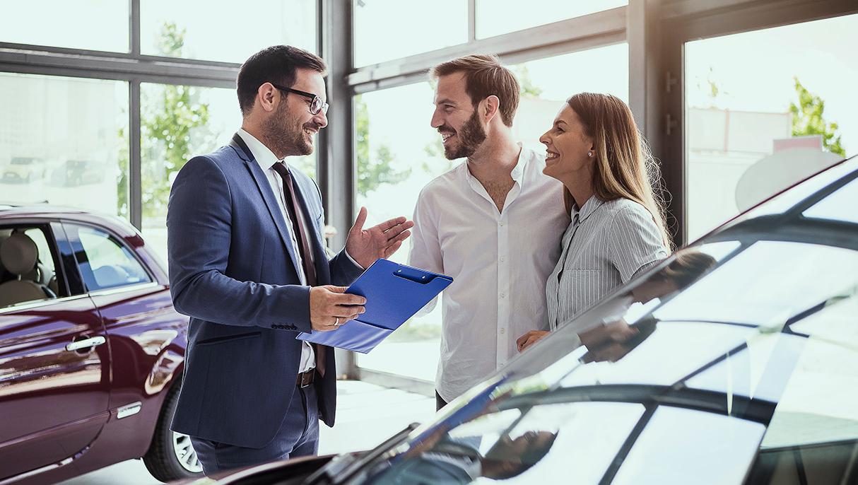 Salesperson speaking with customers