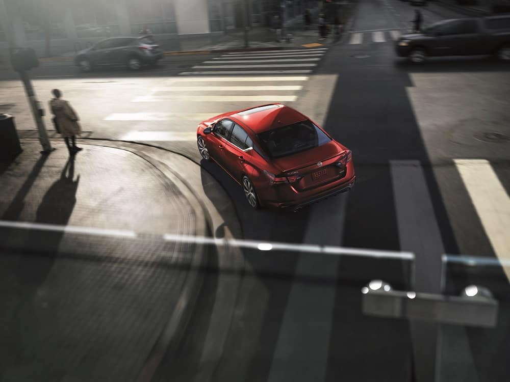 Nissan Altima driving in the city