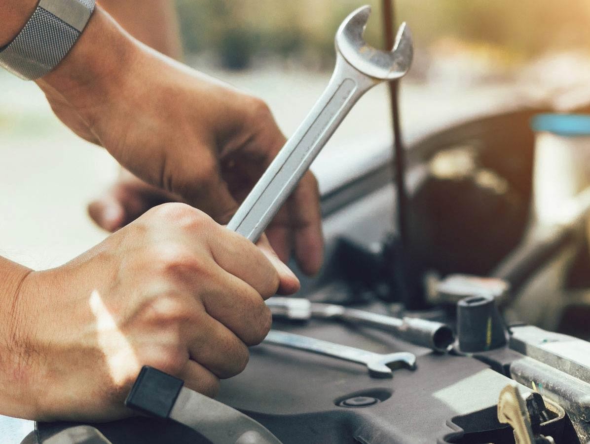 Technician Servicing the Vehicle