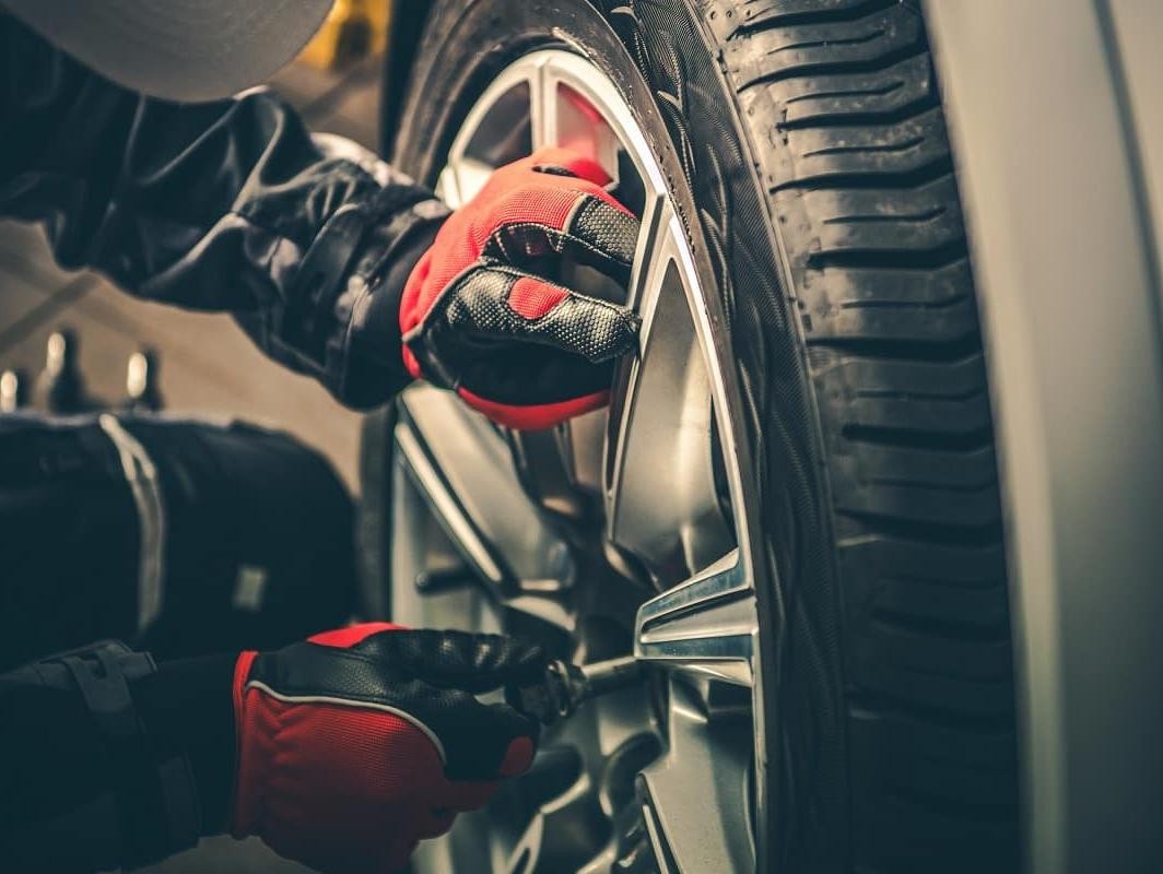 Technician rotating tire