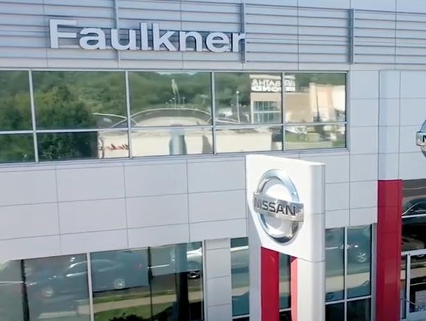Nissan 2021 Generic dealership with vehicle at side