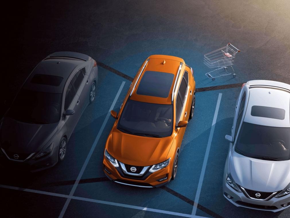 Orange Nissan Rogue Parked in Parking Lot