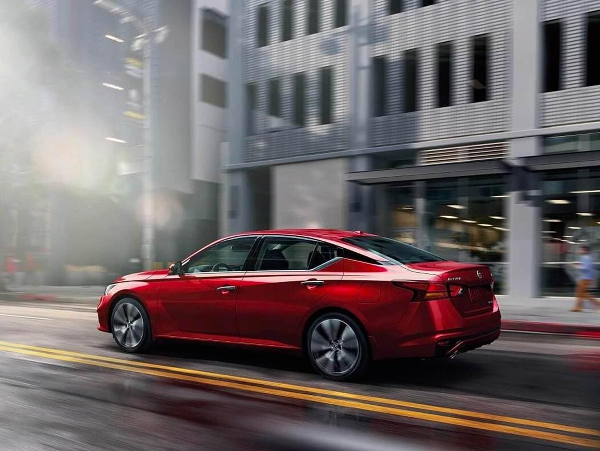 Red Nissan Altima on City Roads