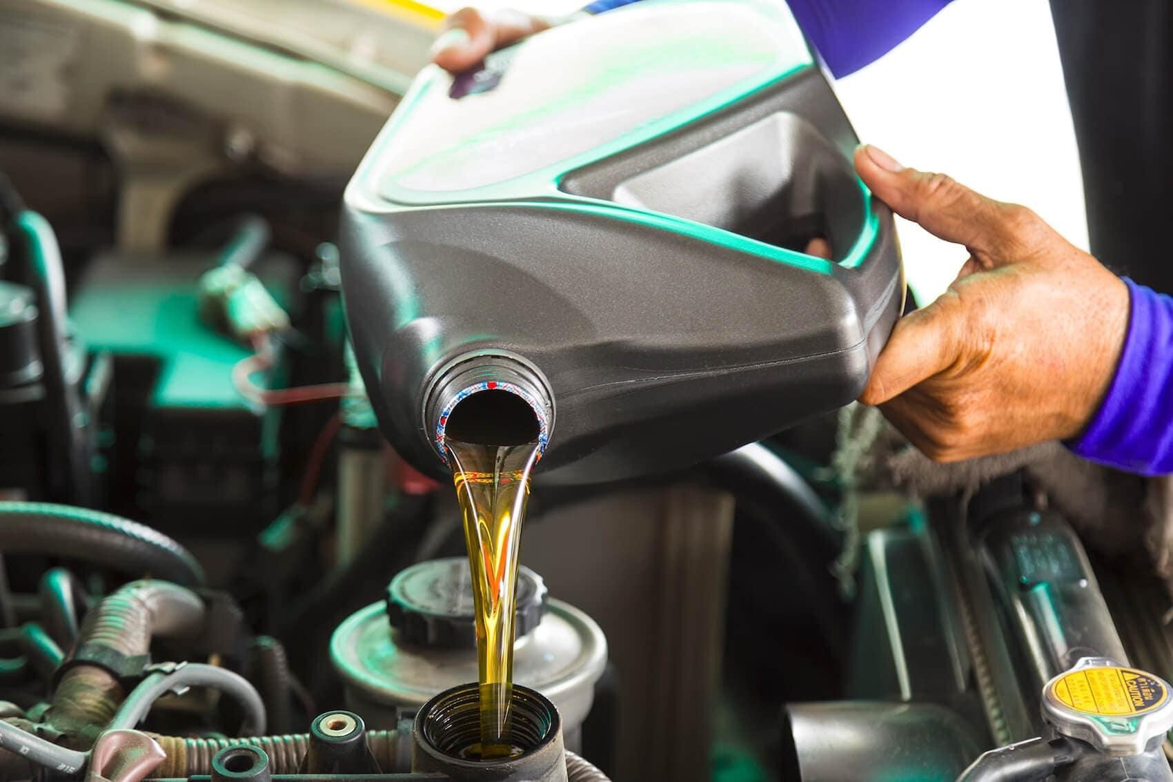 Technician changing oil