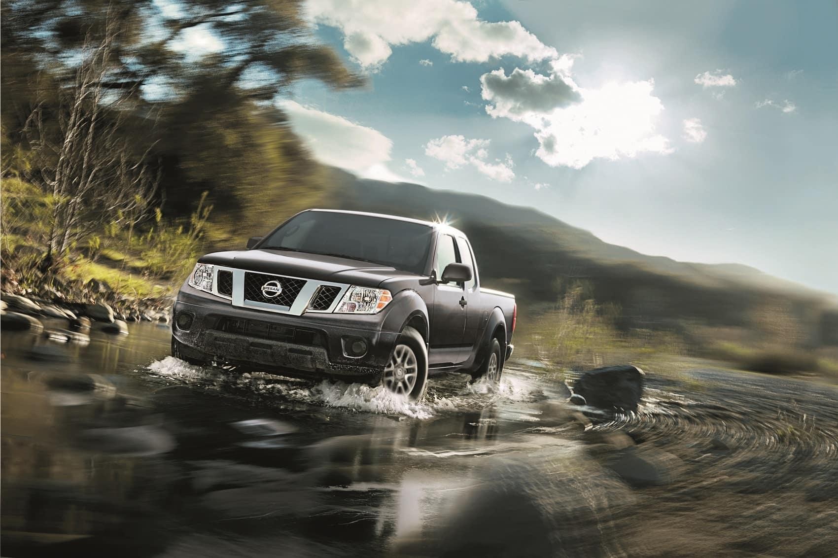 Nissan Frontier driving through road