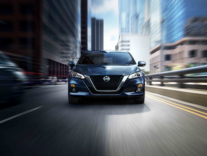 Nissan Altima speeding on road
